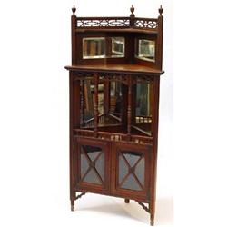 Edwardian walnut corner unit, the fretwork and mirrored back with urn finials and turned supports…