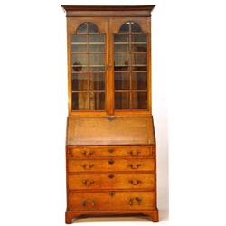 Victorian oak bureau bookcase, fitted a pair of glazed doors enclosing three adjustable shelves, …