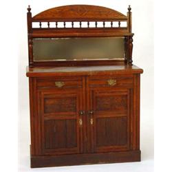 Edwardian carved walnut mirrored back chiffonier with a pair of drawers above cupboard doors…