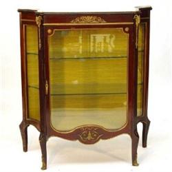 Mahogany pier cabinet with marble top above a glazed door, flanked by a pair of concave glazed si…