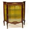 Image 1 : Mahogany pier cabinet with marble top above a glazed door, flanked by a pair of concave glazed si…