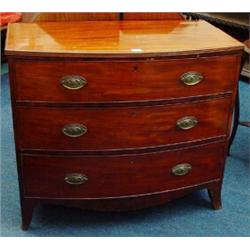 Regency bow fronted mahogany chest, the top with banded inlay, above three cockbeaded drawers on …