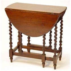 Oval oak gateleg table on barleytwist and leaf carved supports…