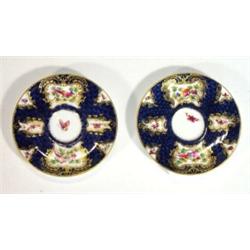 Pair of hand painted Worcester Blue Scale style saucers, decorated with panels of birds and butte…