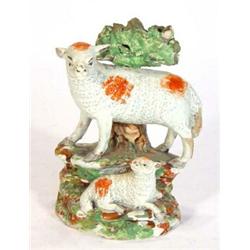 Early 19th century hand painted Staffordshire pearlware animal group of a ewe and her lamb beside…