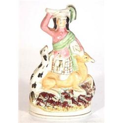 Hand painted Victorian Staffordshire figure of a Scottish man on a deer with a dog, 20cm high…