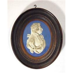 Oval Wedgwood deep blue and white Jasperware medallion portrait plaque of George III, impressed W…