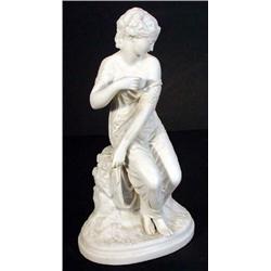 Victorian Parian figurine of a scantily clad seated young maiden,34cm high…