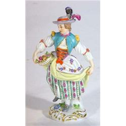 Hand painted Meissen figurine of a young girl with a basket of flowers, blue underglazed cross sw…