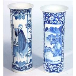 Two cylindrical Chinese spill vases, hand painted with blue and white panels of mountains and fig…