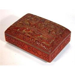 Rectangular red lacquer box with chinoiserie scenes and with blue enamelled interior, 16cm in len…