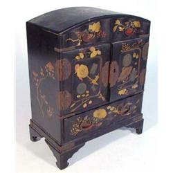 Japanese black lacquer cabinet, gilded with flowers, fitted with an arrangement of cupboard doors…