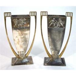 Pair of rectangular based WMF twin handled and silver plated vases moulded with panels of Roman g…