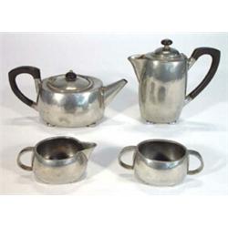 Four piece Liberty's Tudric pewter teaset, comprised teapot, hot water pot, twin handled sugar bo…