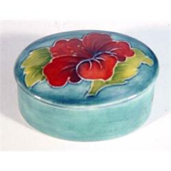 Oval Moorcroft 'Frilled Orchid' patterned trinket box, impressed marks to base, 8cm in length…