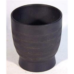 Wedgwood Keith Murray designed black basalt vase, incised with bands of chevrons, various marks a…