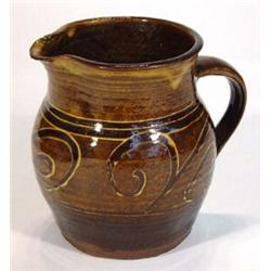 Sidney Tustin Winchcombe pottery jug, decorated with a band of abstract swirls, impressed marks t…