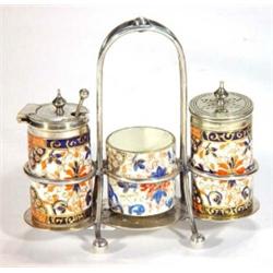 Three piece Victorian cruet set, decorated in an Imari style with silver plated stand…