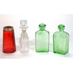 Two etched green glass bottles and stoppers, cut glass bottle and stopper and a cranberry glass s…