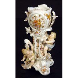 Continental porcelain vase, moulded with cherubs chasing birds, marks to base, 18cm high…