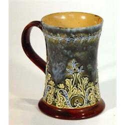 Doulton Lambeth stoneware tankard decorated with stylized leaves onto a green ground, impressed m…