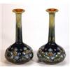 Image 1 : Pair of slender necked Doulton Lambeth stoneware vases, decorated with a band of stylized flowers…