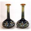 Image 1 : Pair of slender necked Doulton Lambeth stoneware vases, decorated with a band of stylized flowers…