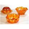 Image 1 : Group of orange Carnival glassware including two fluted bowls, pedestal bowl and a rosebowl, larg…