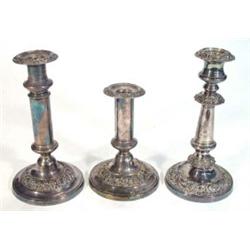 Three early Victorian Sheffield plate circular based candlesticks with floral and leaf design dec…