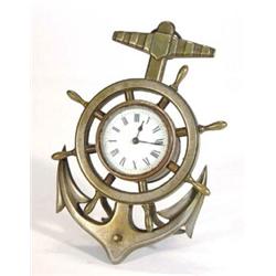 Brass ship's wheel and anchor design clock stand with inset enamelled dialled clock, 23cm high…