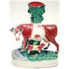Image 1 : A Victorian Staffordshire pottery spill vase, model of a cow and suckling calf, on oval base, 11i...
