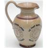 Image 1 : A Doulton Lambeth salt-glazed stoneware ale jug, inscribed with motto and moulded in relief, 7.25...