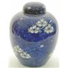 Image 1 : A large Chinese porcelain ginger jar and cover, painted with prunus blossoms against a blue groun...