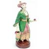 Image 1 : A mid-19th century bone china figure of a Chinaman, wearing full-length green coat and red-stripe...