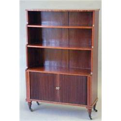 An early 20th century mahogany and string inlaid waterfall bookcase, with three shelves over two...