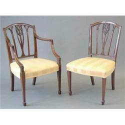 A set of eight Sheraton mahogany dining chairs, (including two with arms), with pierced and swagg...