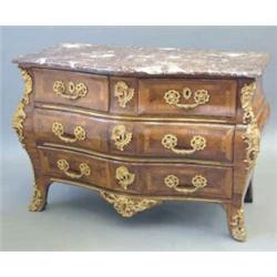 A 19th century mounted kingwood bombe commode, with rouge marble top over a serpentine front of t...