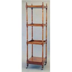 A George IV mahogany four tier whatnot on turned tapered supports and toupie feet, fitted brass c...