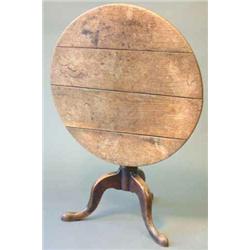 An 18th century elm circular occasional table with vase stem and tripod, 2ft.9ins....