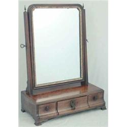 A Georgian design toilet mirror with three concave drawers on ogee bracket feet, 1ft.3.5ins....