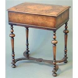 An early 20th century walnut William and Mary design rectangular sewing box, on knopped and balus...