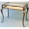 Image 1 : An early 20th century mahogany and parcel gilt bijouterie table, with serpentine sides and bevell...