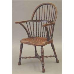 A Victorian mahogany Windsor chair, with turned spindle curved back and rope twist arm supports,...