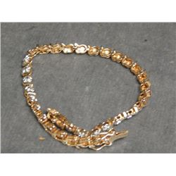 BRACLET - LADIES DIAMOND TENNIS BRACELET SET WITH DIAMONDS - STERLING SILVER SETTING WITH 10 KT GOLD