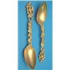 Image 1 : A pair of gilt serving spoons with vineous handles, in fitted case....