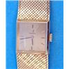 Image 1 : A ladys 18ct gold Omega wrist watch with integral flexible bracelet and square dial....