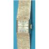 Image 1 : A ladys 9ct gold Omega wrist watch with square dial and integral textured bracelet....