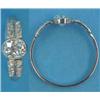 Image 1 : A white metal solitaire diamond ring, collet set with an oval brilliant cut stone, each shoulder...