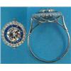 Image 1 : A white metal diamond and sapphire target ring, the millegrain set brilliant cut diamond bordered...