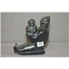 Image 1 : A hand carved soapstone figure of a parent and child on sleigh 6" in height